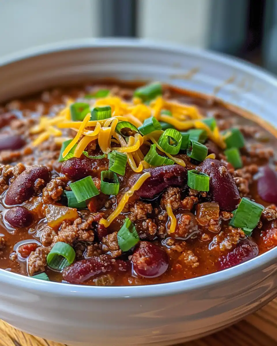Easy skillet chili cooking with steam rising from pressure cooker