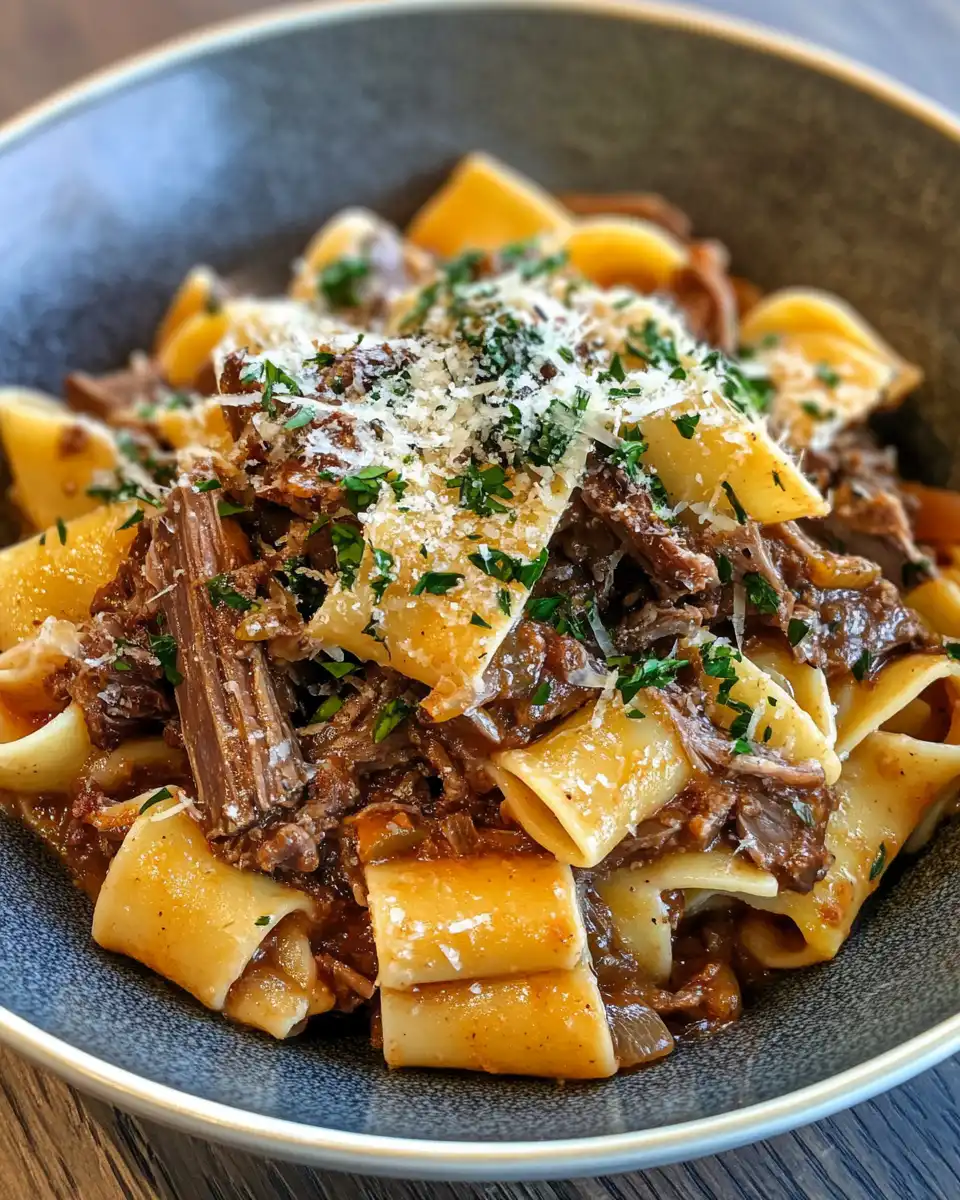 Serving short rib ragu on pappardelle with Parmesan