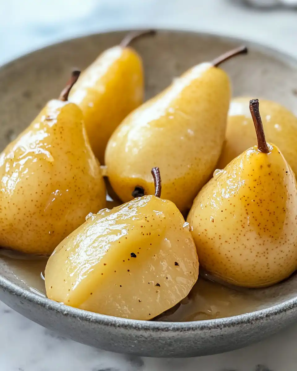Close up of buttery roasted pears cooking in pressure cooker with steam